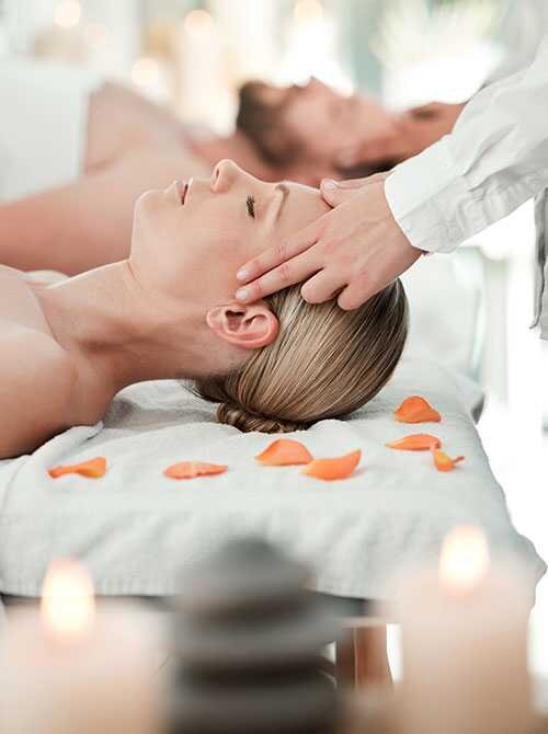 Woman getting a head massage in a spa.